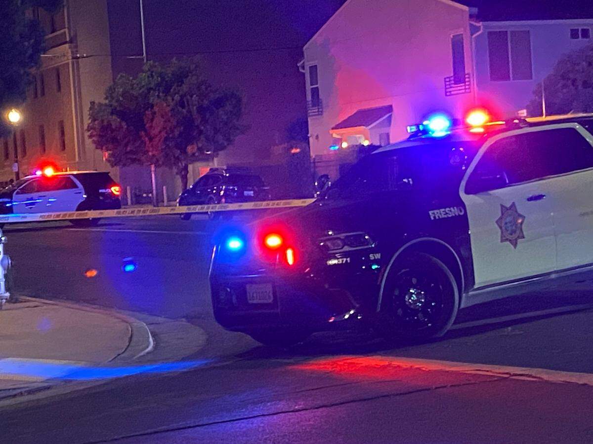 Officers tape off Van Ness and Calaveras after a man was found dead in downtown Fresno on Friday, May 23, 2025.