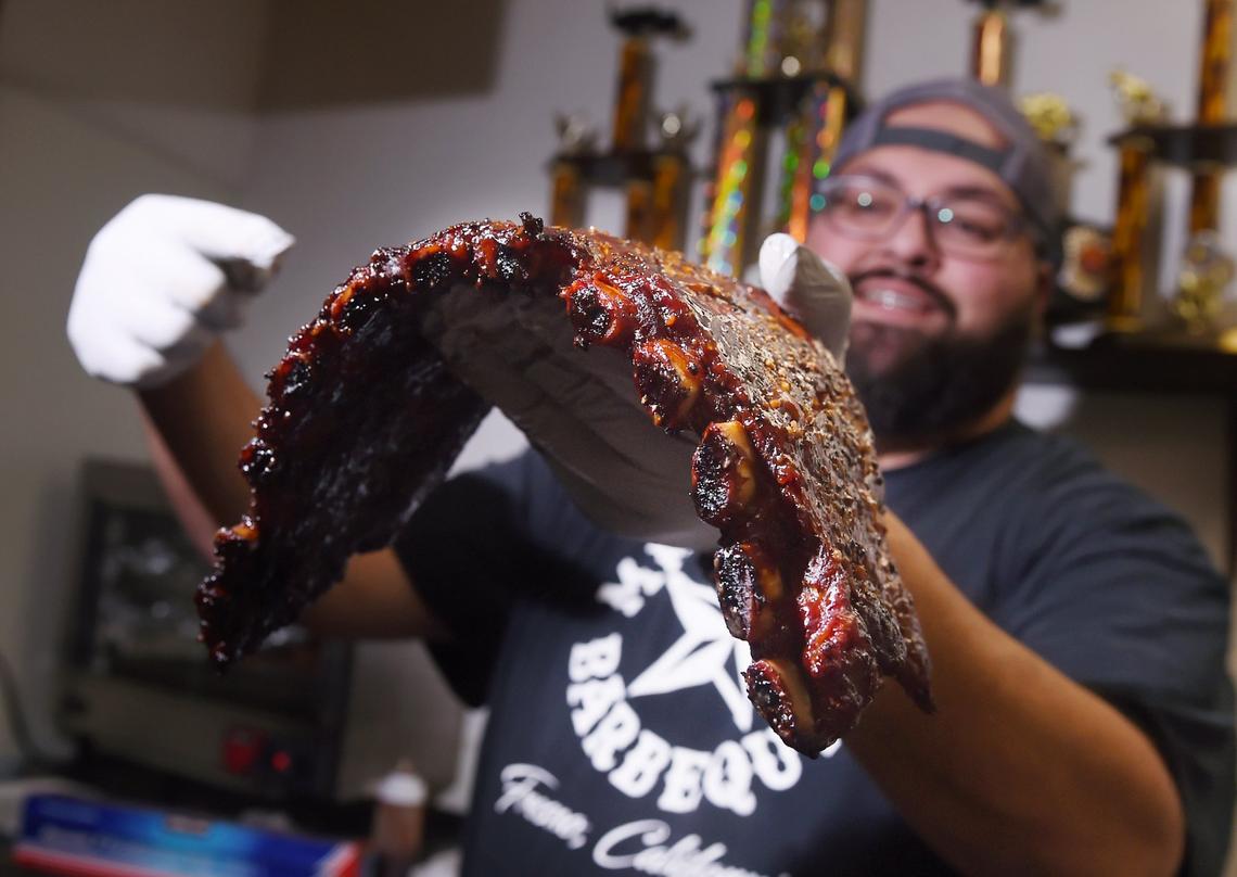 Anthony Vallejo, with a rack of ribs, photographed at Mega Texas Barbeque Friday, Feb. 1, 2019 in Fresno.
