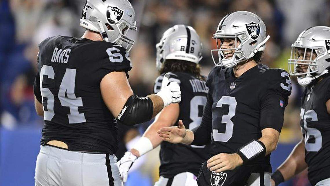 Las Vegas Raiders quarterback Jarrett Stidham celebrates with guard Alex Bars after scoring a touchdown during the first half of the team’s NFL exhibition Hall of Fame Game against the Jacksonville Jaguars, Thursday, Aug. 4, 2022, in Canton, Ohio.