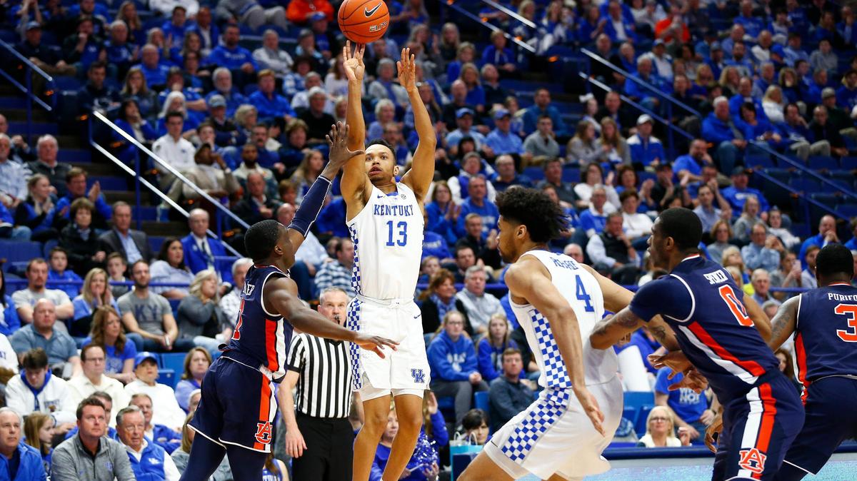 Kentucky Wildcats guard Jemarl Baker Jr. (13) shot for thee over Auburn Tigers guard Jared Harper (1) during their game Saturday at Rupp Arena in Lexington. Kentucky beat Auburn 80-53.