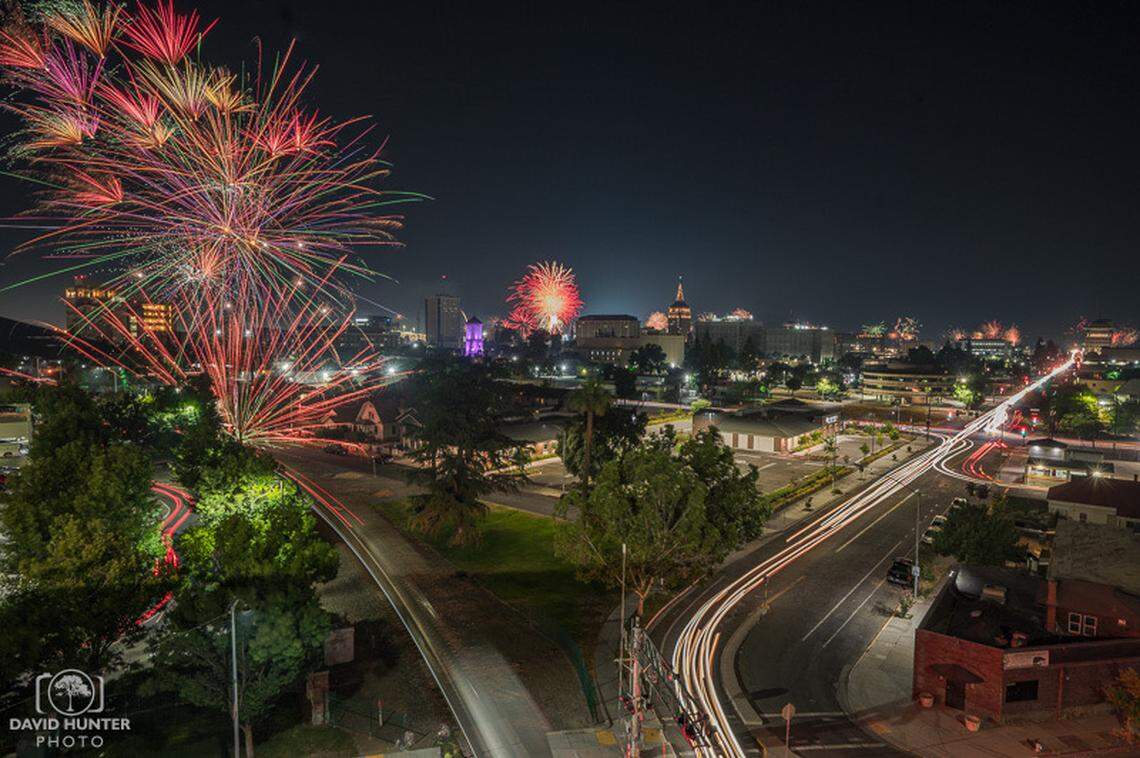 Fireworks displays, mostly of the illegal variety, light up the evening skies above downtown Fresno on July 4th, 2023, as captured by local photographer David Hunter from the Community Regional Medical Center employee parking garage. This is a photo composite made up of about 40 images taken over the course of 2 hours.