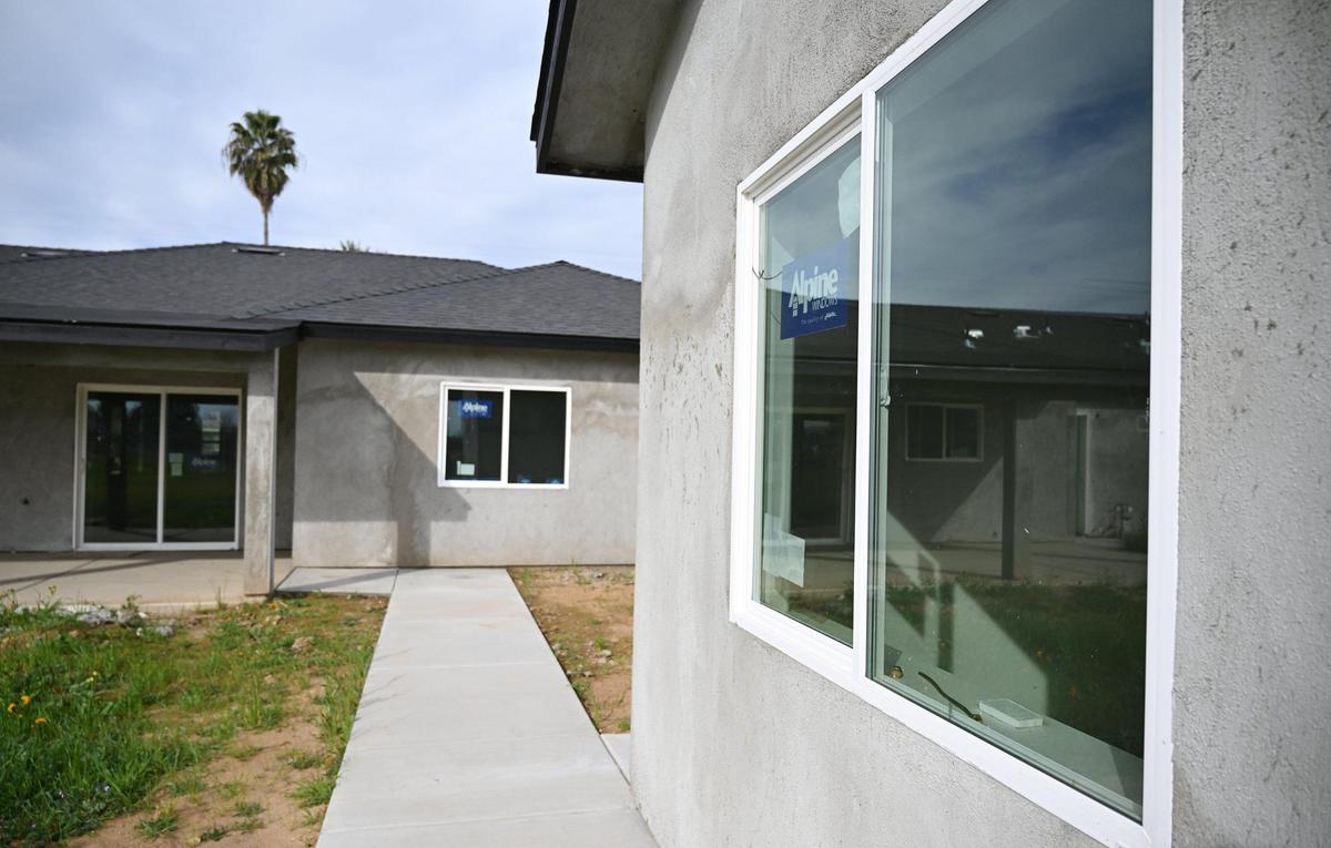 A detached ADU unit, right, is seen behind the main home on a property Friday, Feb. 28, 2025 in Madera County.