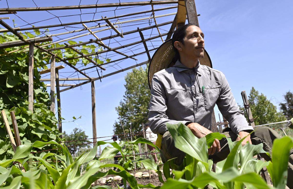 Aaron De La Cerda sits in the Yo'Ville Community Garden and Farm Thursday, April 16, 2026 in west Fresno.