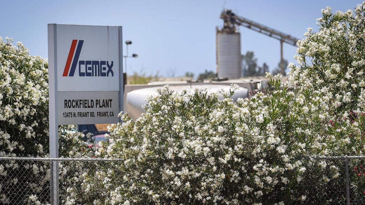 A sign for the CEMEX Rockfield aggregate plant site in Friant is visible from Friant Road on Wednesday, June 17, 2020. The company applied to Fresno County to continue mining the quarry for 100 years, and use blasting and drilling to mine a 600-ft deep pit.