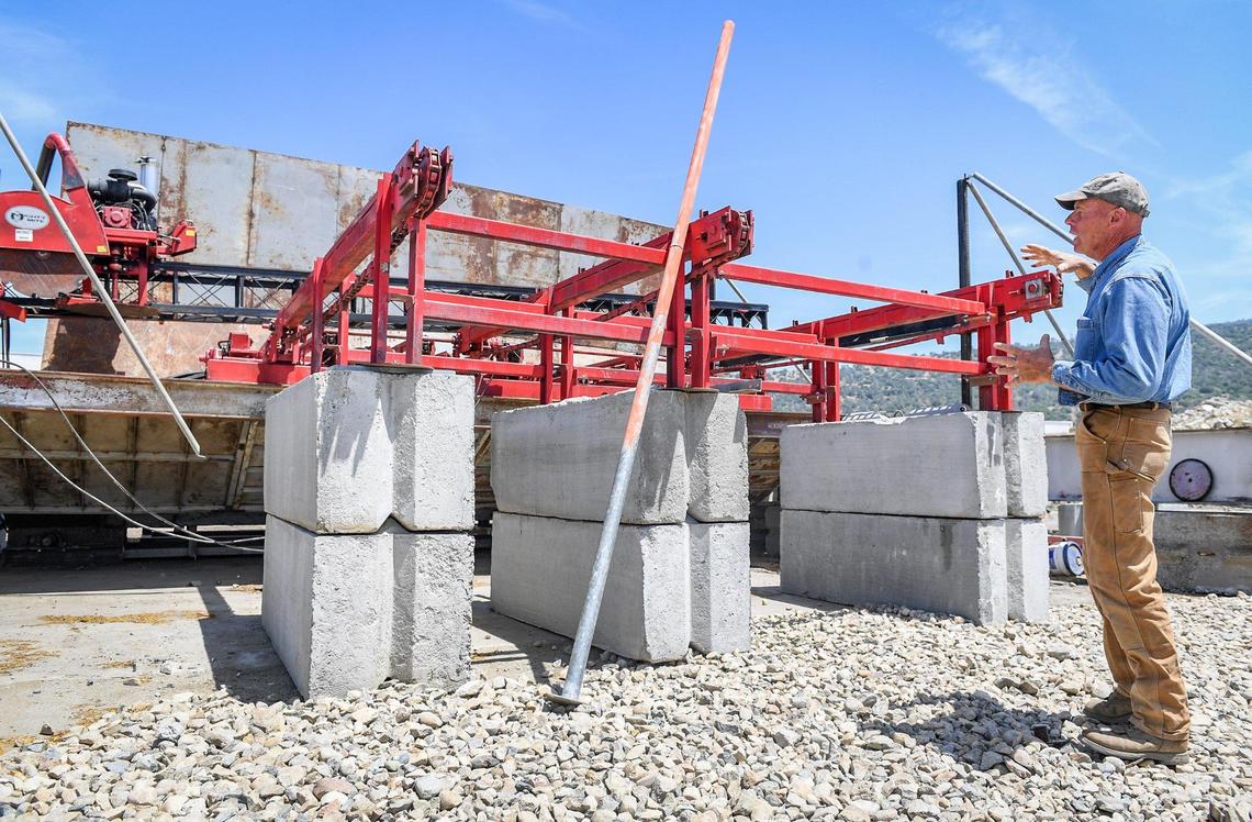 Kirk Ringgold describes how a piece of sawmill equipment will operate while working toward starting up his Auberry mill in the coming months, on Thursday, May 13, 2021.