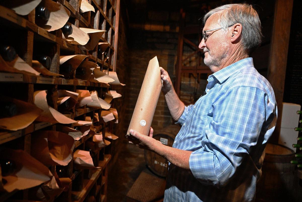 Peter Ficklin checks on a customer’s stored port wine at Ficklin Vineyard which is part of the Madera Wine Trail. Photographed Wednesday, Aug. 21, 2024 near Madera, CA.