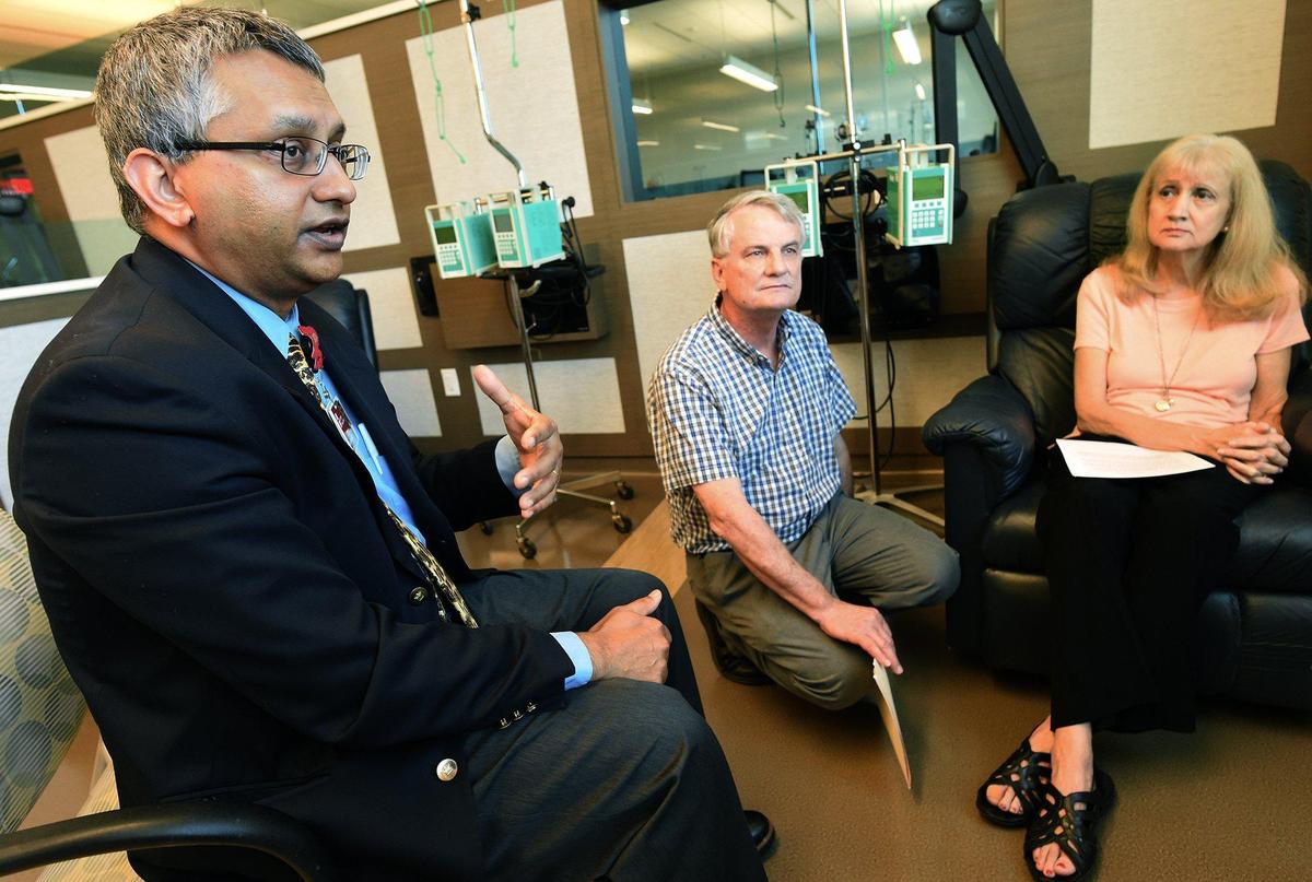 Fresno oncologist Dr. Ravi Rao, left, with patient Norma Smith and her husband Rod, voices his frustration in working with PBMs – pharmacy benefit managers – in treating his patients. Photographed at cCARE Cancer Center, Thursday July 11, 2019.