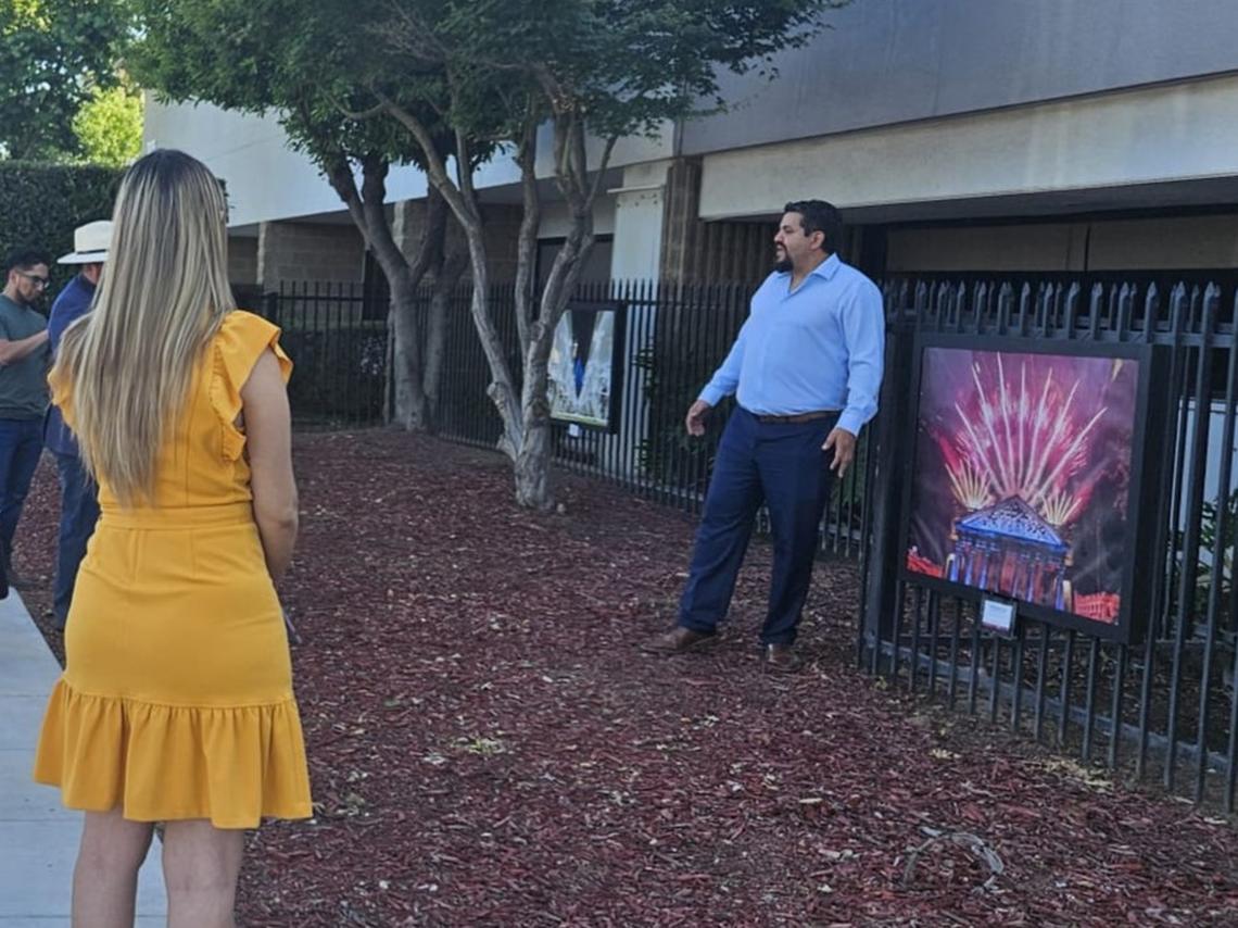 Guadalajara born Mexican photographer Luis Ramírez Corral next to one of the 12 photographs of the ‘Guadalajara, Sister City’ exhibition at the gates of the Consulate of Mexico in Fresno on Ingram Avenue.