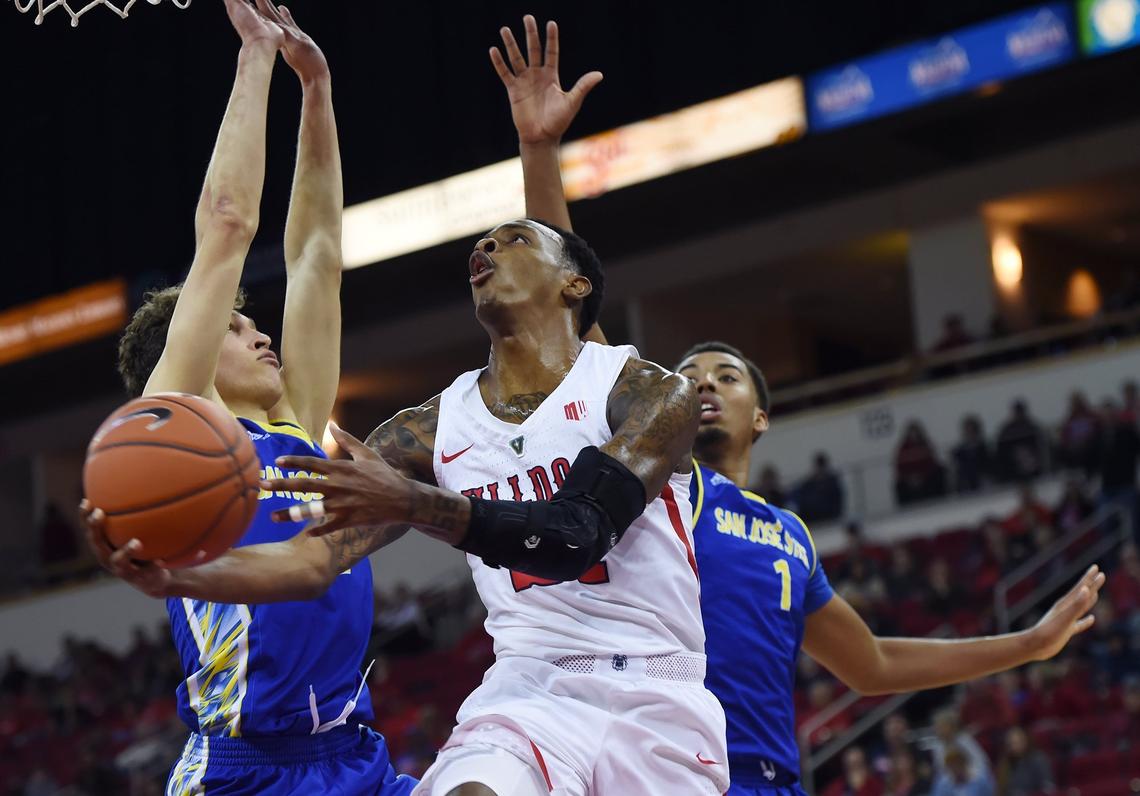Fresno State guard Deshon Taylor drives by San Jose State’s Brae Ivey, left, and Michael Steadman, right, in the first half of the Bulldogs’ 121-81 victory over the Spartans Saturday, March 9, 2019 in Fresno. Taylor scored a career-high 37 points, Braxton Huggins had a career-high 34 and Noah Blackwell a career-high 25.