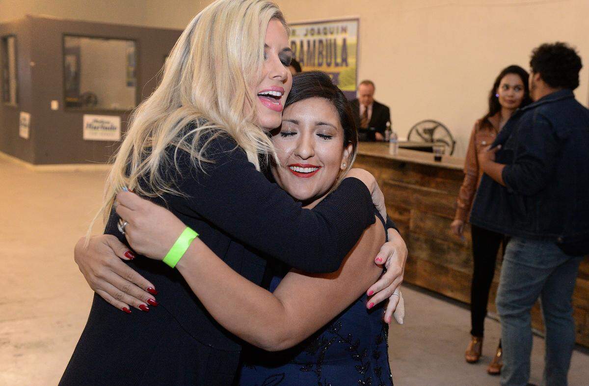 California senate candidate Melissa Hurtado, right, hugs supporter Elizabeth Aramula, wife of California assemblymember Joaquin Arambula, while attending an election party at the Broadway Event Center in downtown Fresno on Tuesday, Nov. 6, 2018.