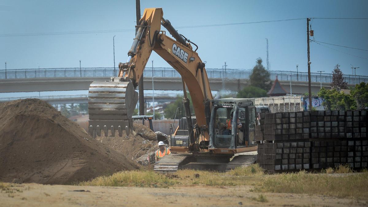 Construction crews work in the high-speed rail area between downtown Fresno and Chinatown on Tuesday, April 28, 2020. Coronavirus orders have affected business in Chinatown already hit hard by high-speed rail construction road closures as well as the ongoing homeless problem.