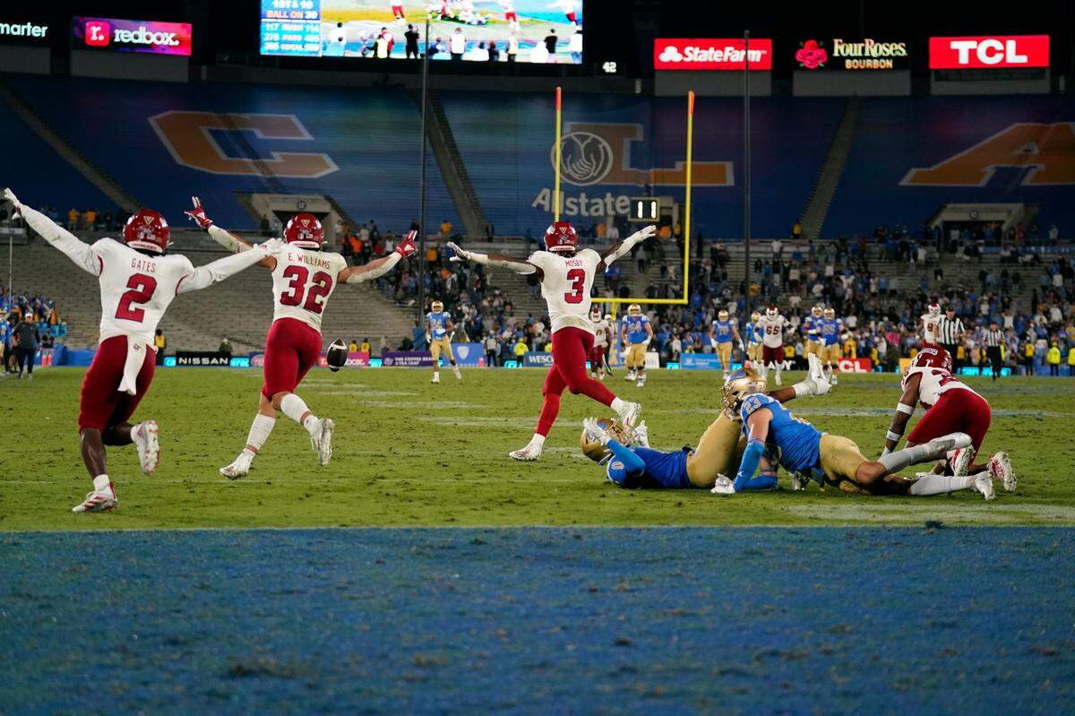Fresno State players celebrate after an incomplete Hail Mary pass to end the NCAA college football game against UCLA Sunday, Sept. 19, 2021, in Pasadena, Calif. (AP Photo/Marcio Jose Sanchez)