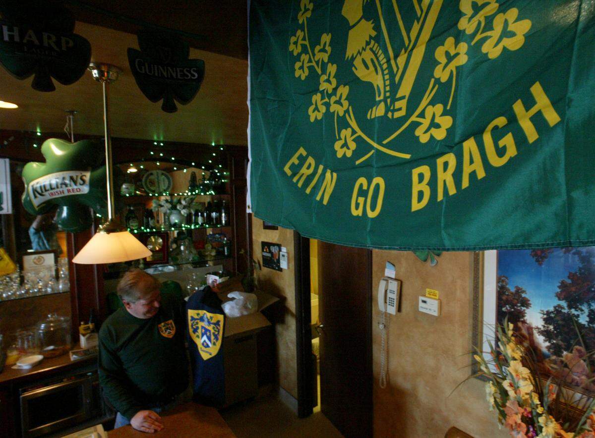 arious Irish flags, such as this one, translated “Ireland Forever” and banners hang from the ceiling of Moynihan’s Pub, which owner Mike Moynihan, left, expects to be packed on Saturday, St. Patrick’s Day. He’s a Fresno native, but also is a citizen of Ireland, where his family is from. John Walker/Fresno Bee