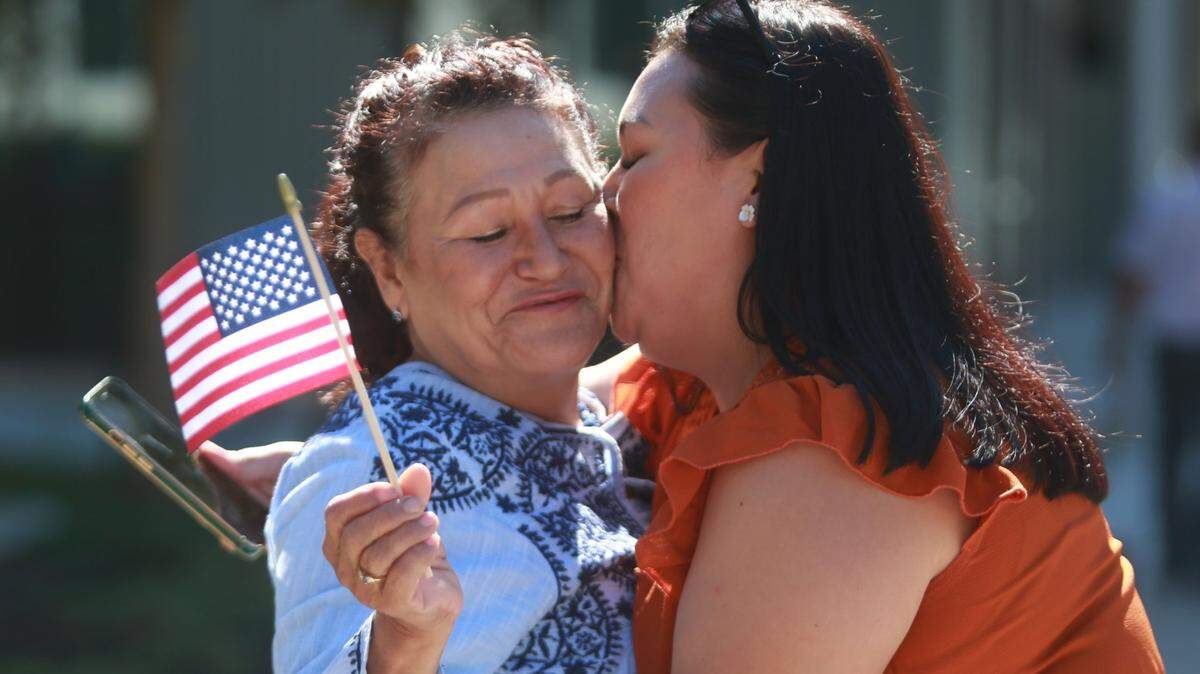 Jéssica Rodríguez kisses her mother Mercedes Heredia who became a US citizen Thursday (Sept. 22) at the offices of the United States Citizenship and Immigration Services in Fresno. The photo won the national José Martí award for best community photo.