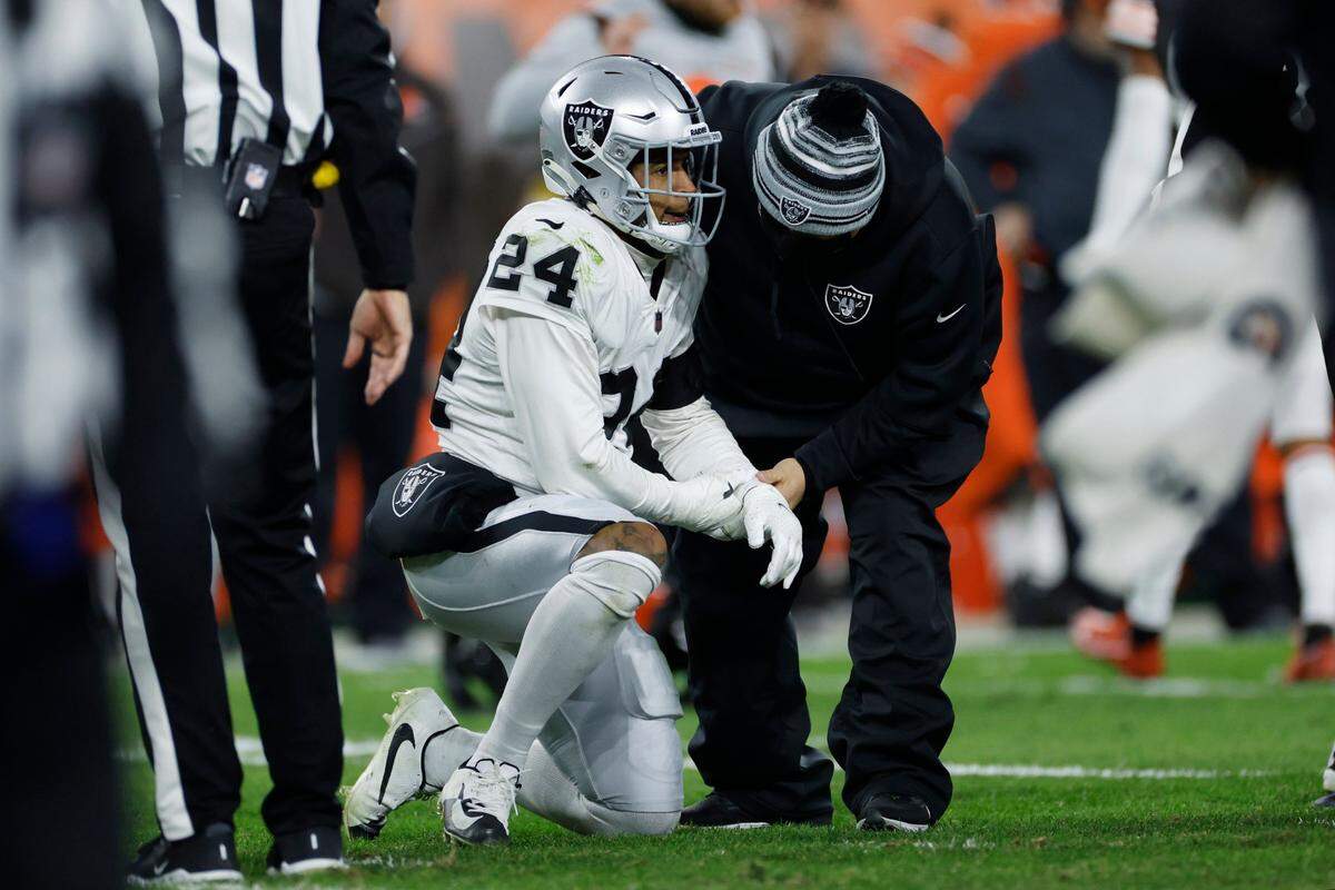 Las Vegas Raiders safety Johnathan Abram gets examined after being injured against the Cleveland Browns during the second half of an NFL game, Monday, Dec. 20, 2021, in Cleveland.