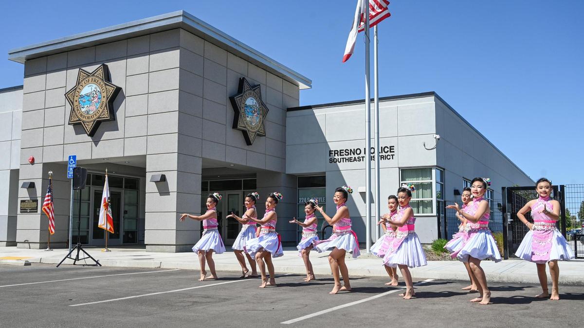 Hmong dancers perform during a dedication ceremony for the Fresno Police Department’s southeast district station, which is being named in honor of Phia Vang who died in an off-duty car crash, on Friday, April 15, 2022.