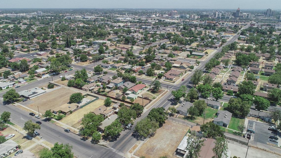 Southwest Fresno is captured in a drone image looking east toward the downtown area on Thursday, July 8, 2021. Southwest Fresno and many other poorer areas of the city are said to suffer from a lack of “tree equity” contrasted with affluent areas that have more trees and green spaces, providing more shade, better air quality and lower energy costs.