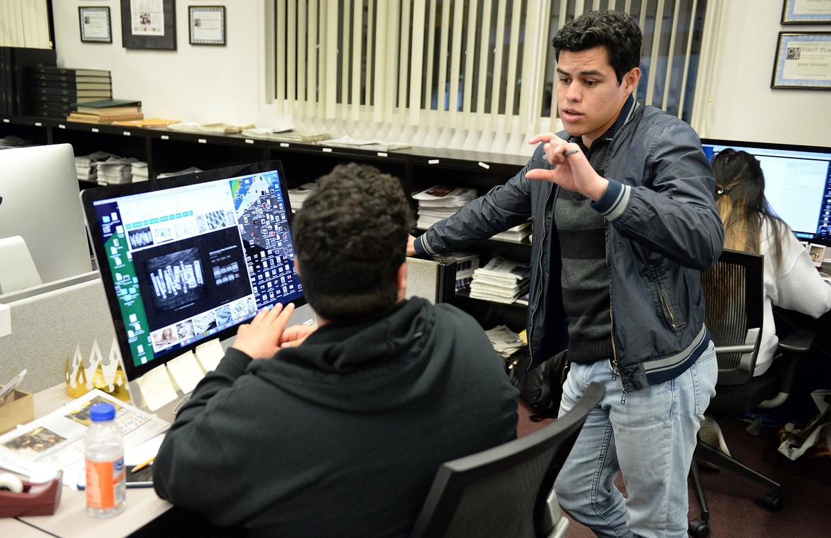 Cresencio Rodriguez-Delgado, right, editor-in-chief of the Fresno State student newspaper, works with news editor Razmik Cañas in The Collegian newsroom at Fresno State while producing the next day's issue, on Tuesday, March 21, 2018.