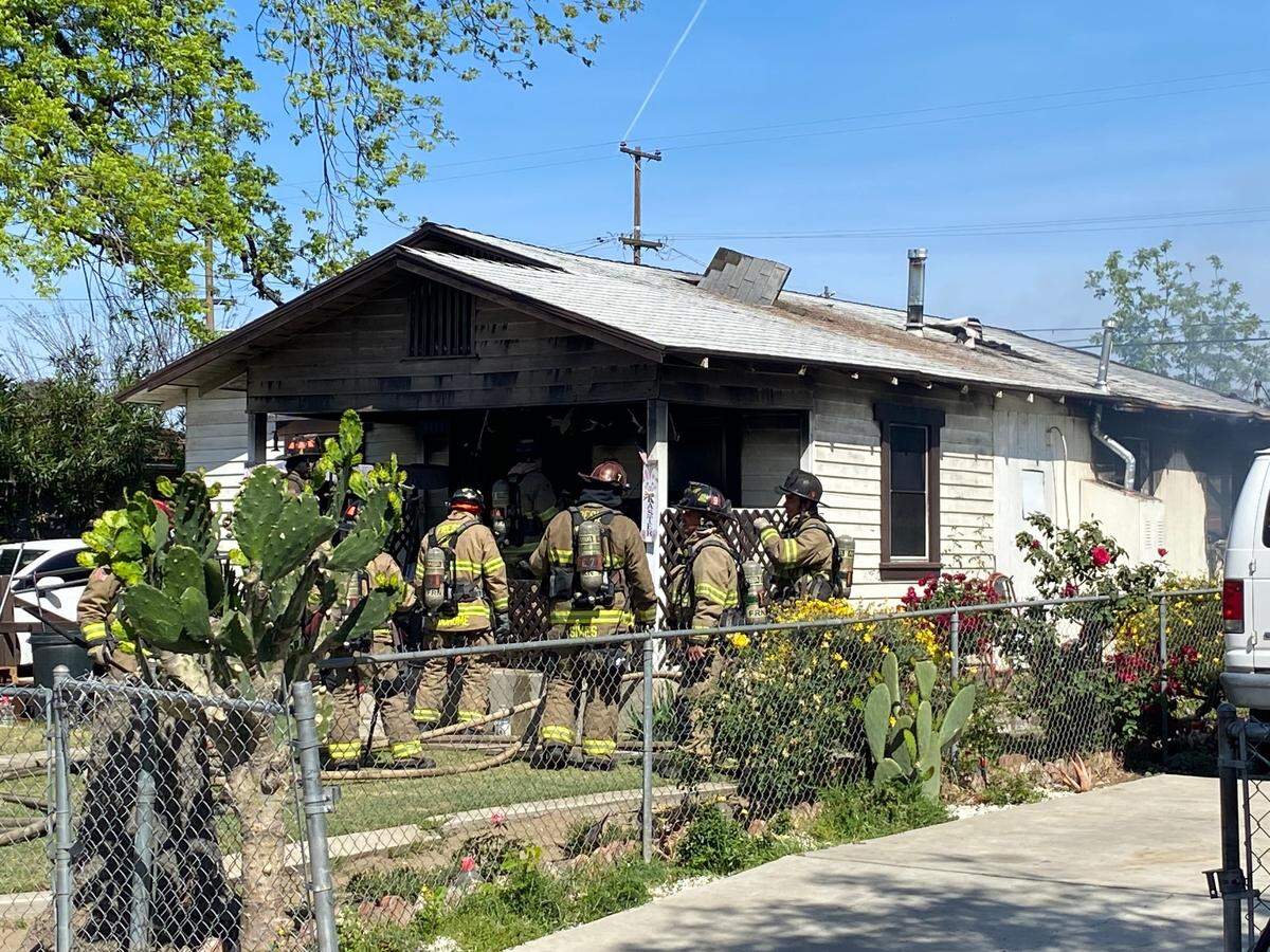 A fire damaged a home on Grant Avenue in southeast Fresno on Thursday, April 14, 2022.