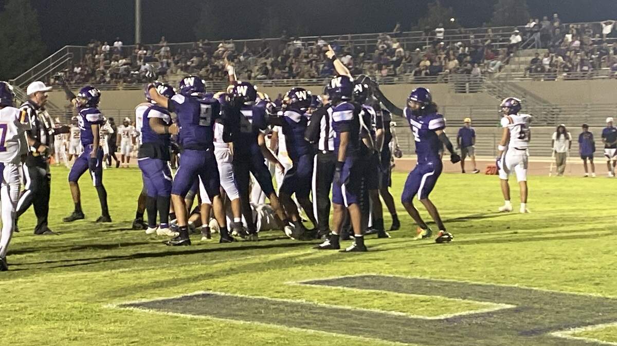 Washington Union picks up a fumble recovery in a 34-21 victory over Lemoore on Friday, Aug. 29, 2025.