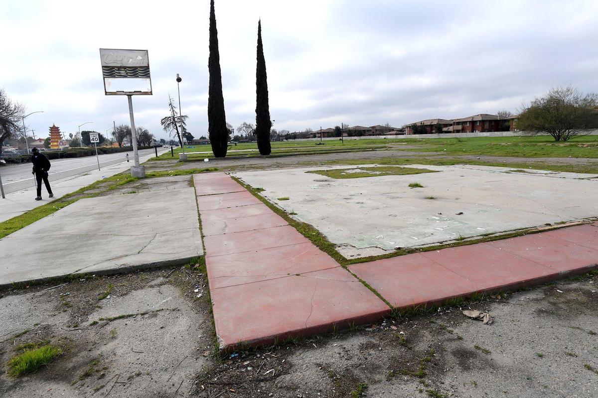 The concrete slab of a former commercial business on South Elm Avenue, Feb. 5, 2021. Though this was likely an eatery, the area is dotted with brownfields- EPA designated land, previously commercially used, where the presence of contaminates is known, which hinders future development without costly abatement.
