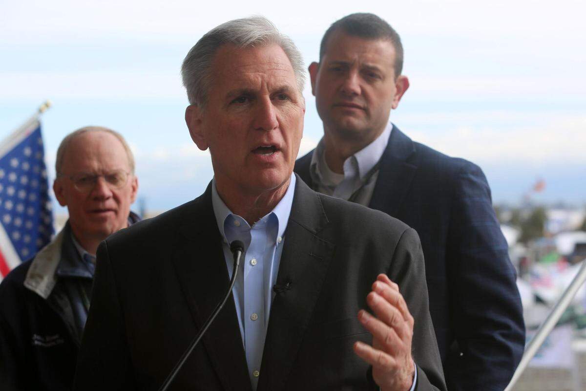 Speaker of the House, Republican Kevin McCarthy of Bakersfield, (center) speaks to the media following the opening ceremonies at the World Ag Expo in Tulare on Tuesday, Feb. 14, 2023.