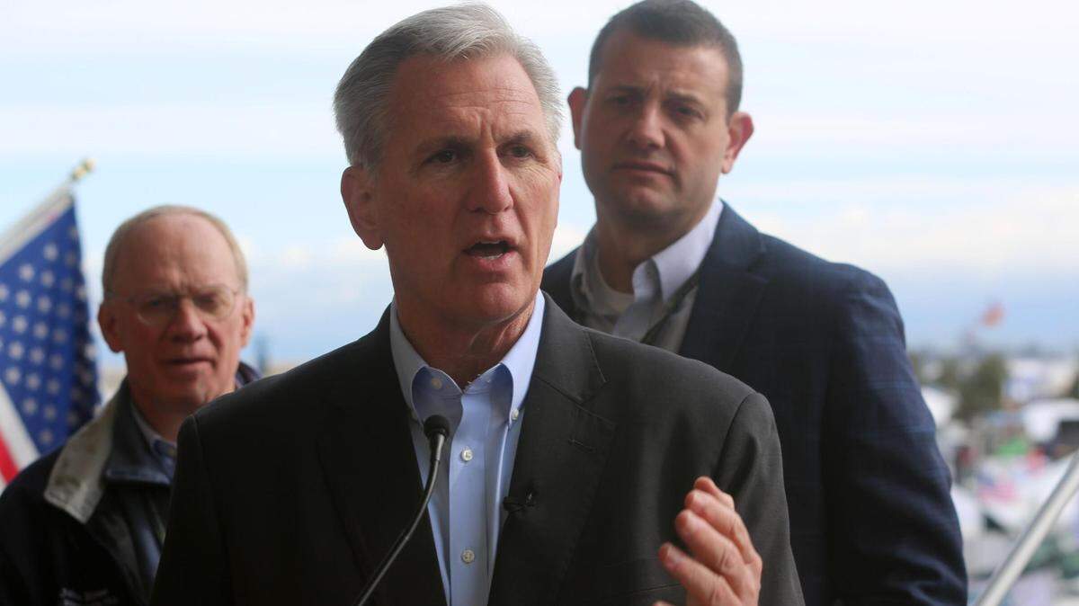 Speaker of the House, Republican Kevin McCarthy of Bakersfield, (center) speaks to the media following the opening ceremonies at the World Ag Expo in Tulare on Tuesday, Feb. 14, 2023.