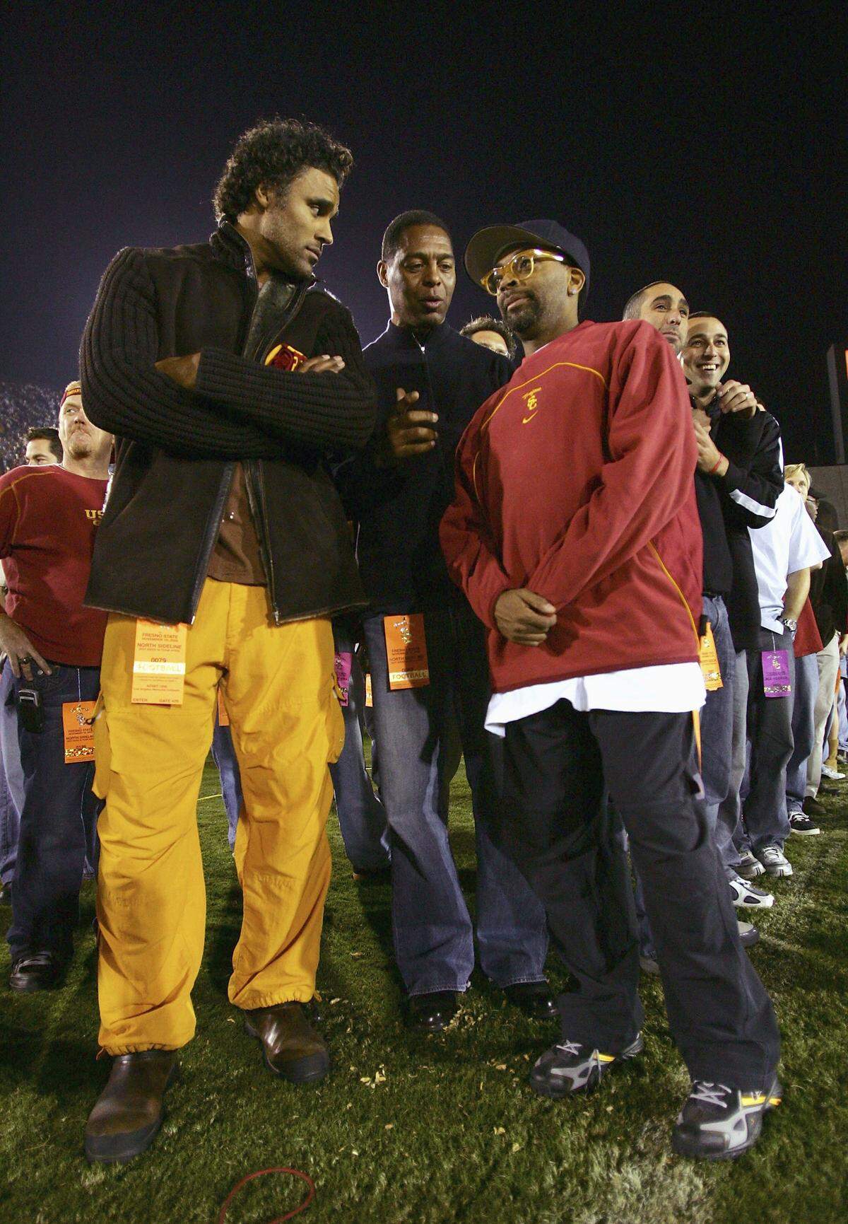 Former NBA player Rick Fox, former NFL and USC player Marcus Allen, and director Spike Lee watch from the sideline during the game between the USC Trojans and the Fresno State Bulldogs at the Los Angeles Memorial Coliseum on November 19, 2005 in Los Angeles, California. The Trojans won 50-42. 