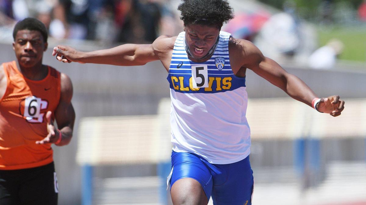 Clovis High’s Nathan Johnson crosses for first place in the 100 Dash Invitational at the West Coast Relays, held Saturday, May 1, 2021 in Clovis. He broke a meet record at the Sanger Metric Classic.