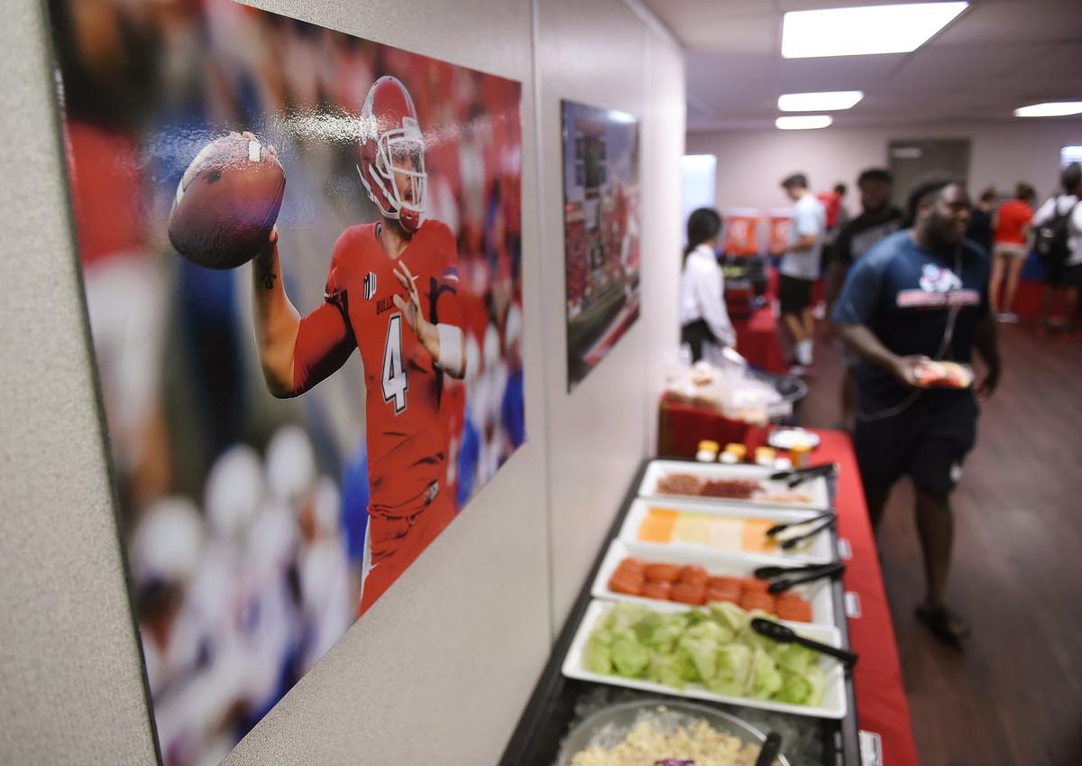 A photograph of Derek Carr is on the wall above a buffet in the Fresno State athletic dining hall.