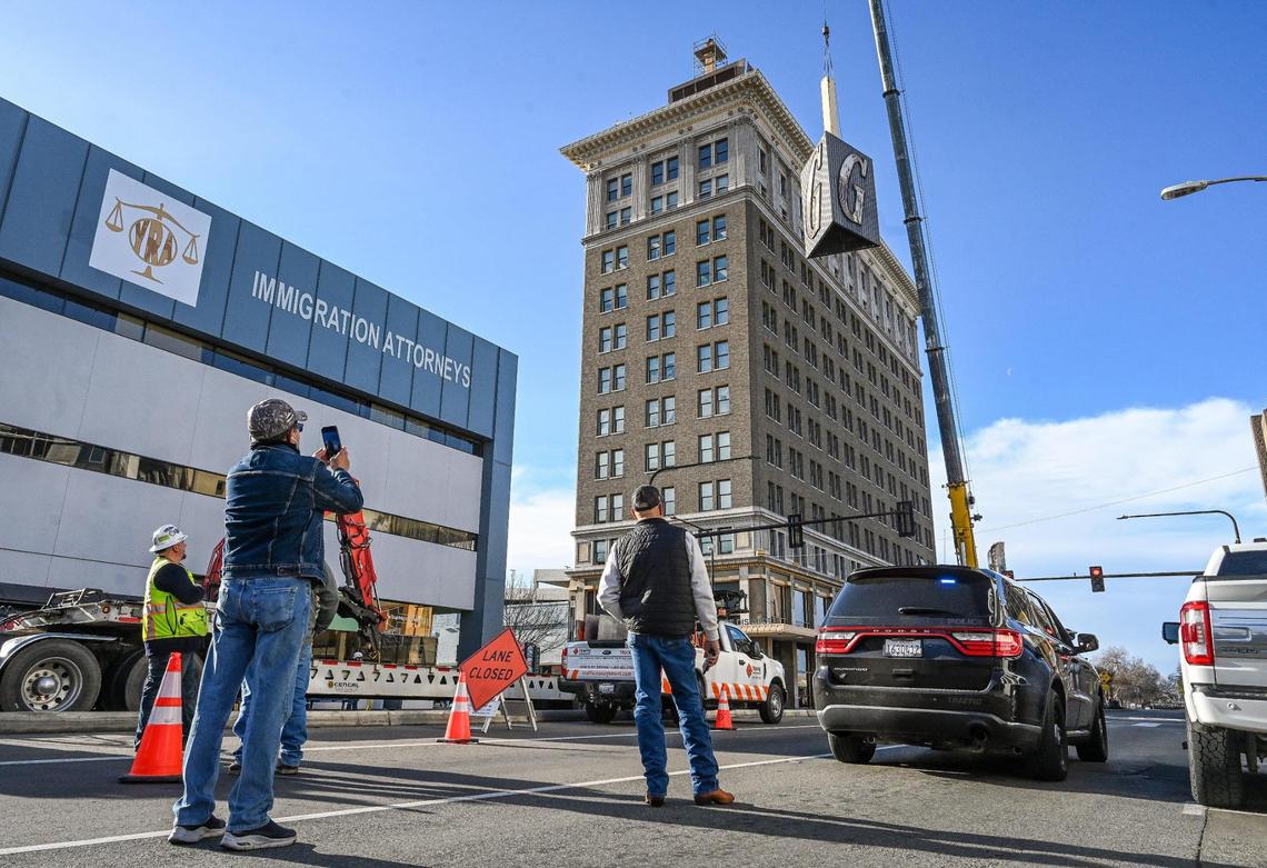 The Guarantee Bank G sign is finally lowered off its perch atop the Guarantee Bank building in downtown Fresno on Saturday, Feb. 3, 3024 after technical difficulties prevented the removal two weeks ago. The State Center Community College District, owners of the building, will be replacing the historic sign with a replica while the original will be displayed with other historic Fresno signs at the Fresno Fairgrounds.
