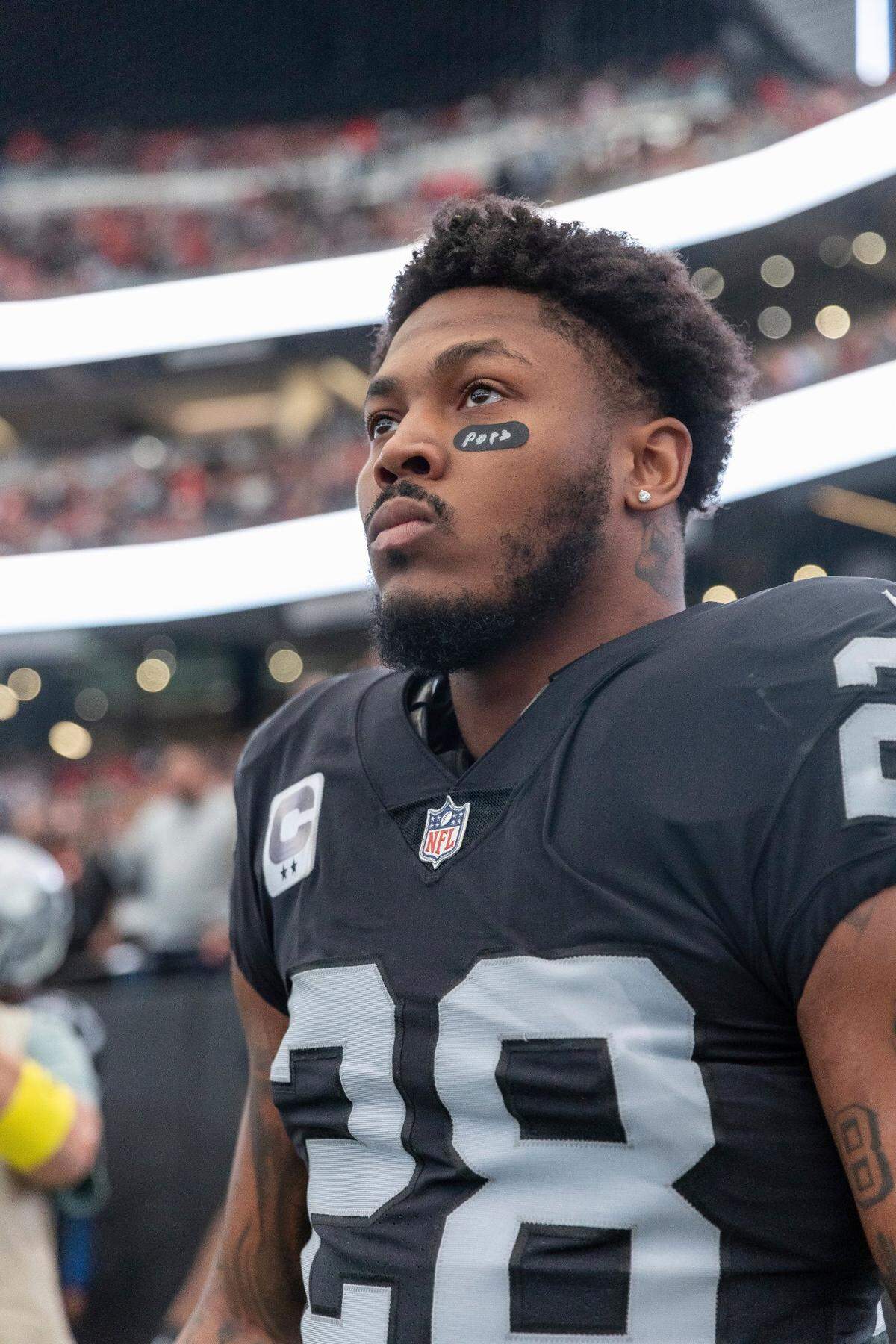 Las Vegas Raiders running back Josh Jacobs stands on the sideline before playing against the Kansas City Chiefs in an NFL game, Saturday, Jan. 7, 2023, in Las Vegas, NV.