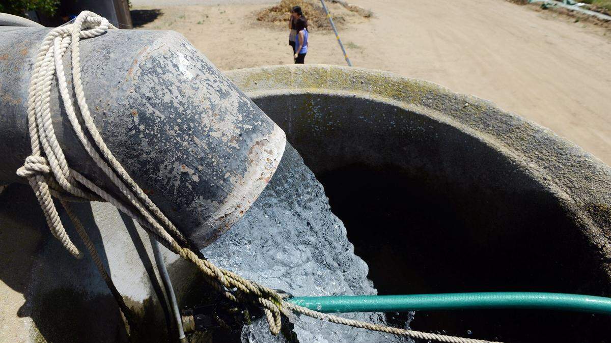 Water flows into a 600-foot well that irrigates crops for a farm in Le Grand.
