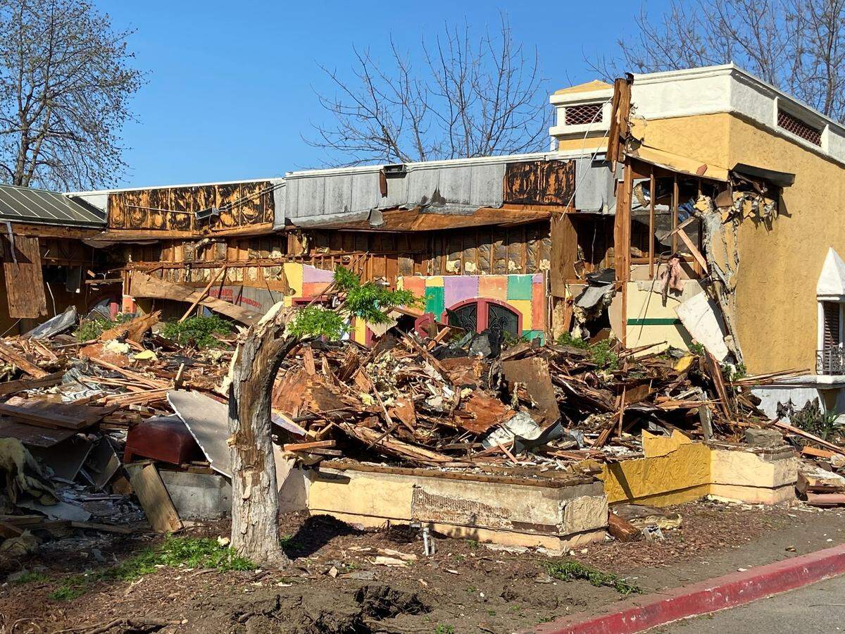 The interior of El Torito is exposed while partway through demolition Friday. The restaurant, viewed here from the parking lot to the south, has been closed since 2018.