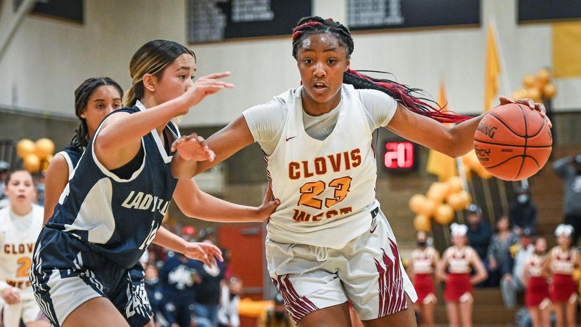 Clovis West’s Etoyah Montgomery, right, drives past Bakersfield’s Sara Shein during their Central Section Open Division championship game at Clovis West on Saturday, Feb. 26, 2022.