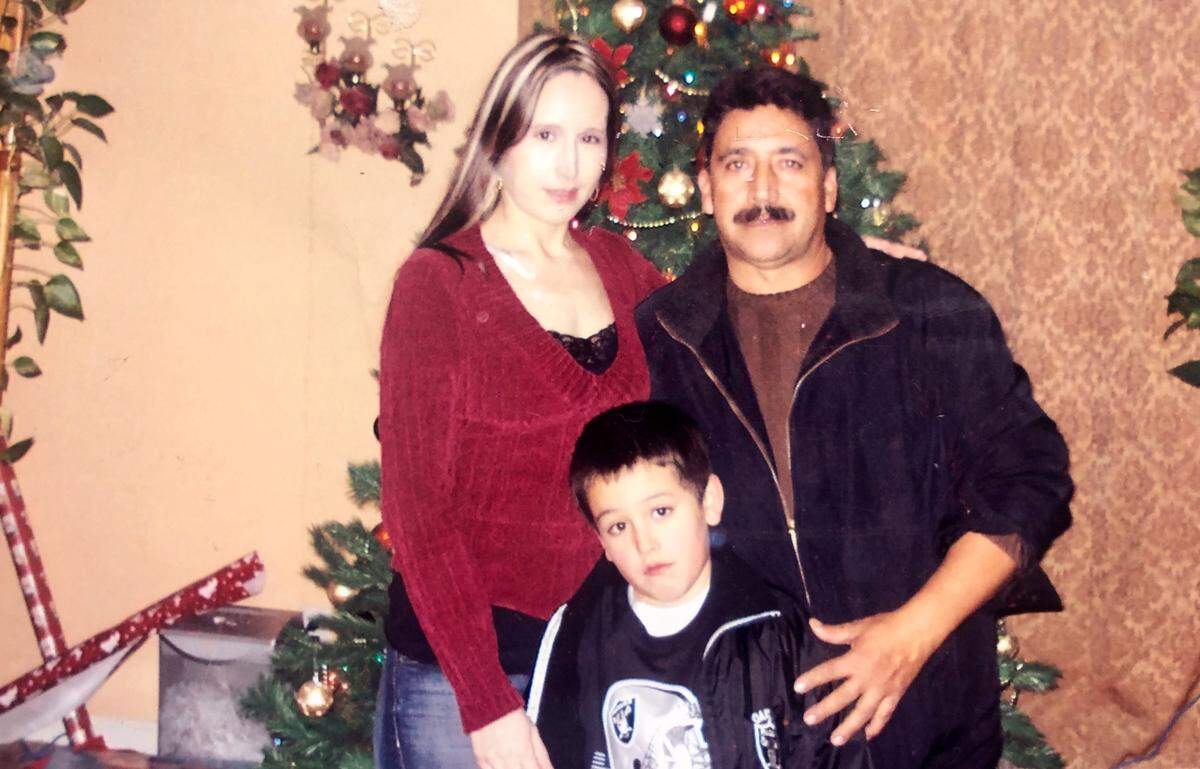 Michael Piña with his parents, Efren and Gloria Piña.