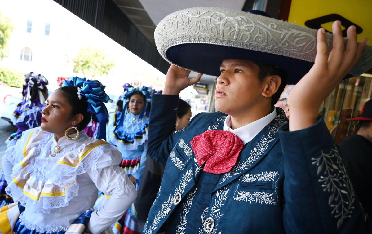Costumed performers await their turn to entertain at the Fiestas Patrias parade, celebrating Mexican Independence Day and more, in downtown Fresno on Saturday, Sept. 17, 2022.