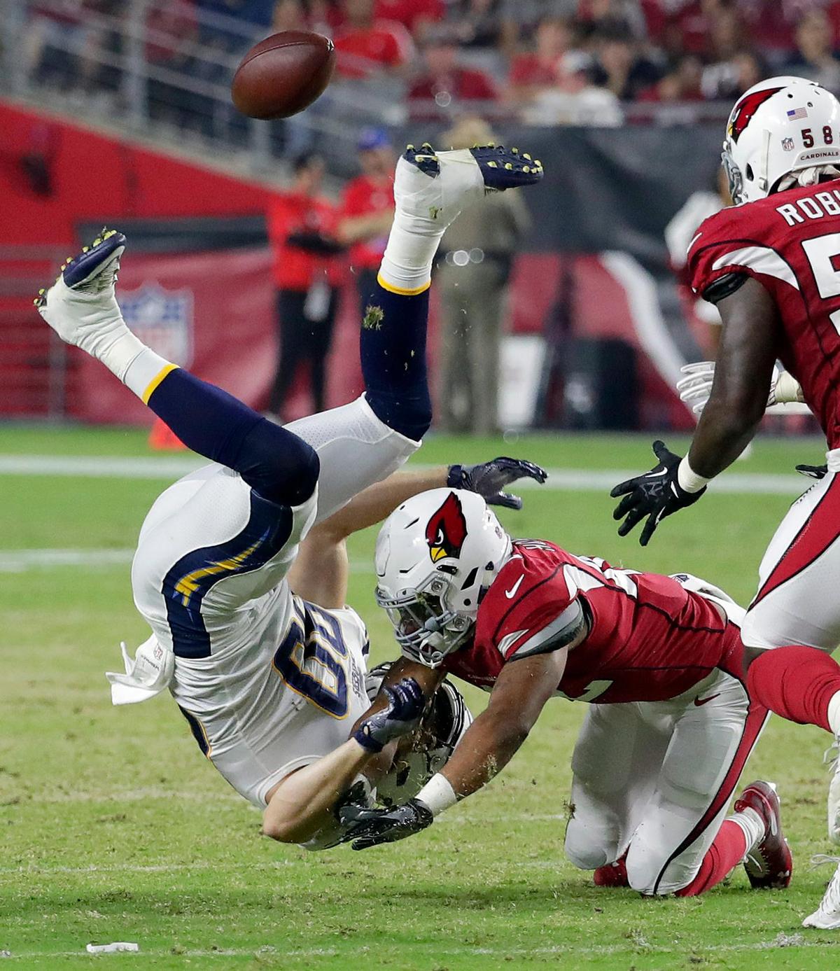 Arizona Cardinals defensive back A.J. Howard, right, commits a personal foul against Los Angeles Chargers tight end Sean Culkin for a 15-yard penalty during the first half of a NFL preseason game, Saturday, Aug. 11, 2018, in Glendale, Ariz.