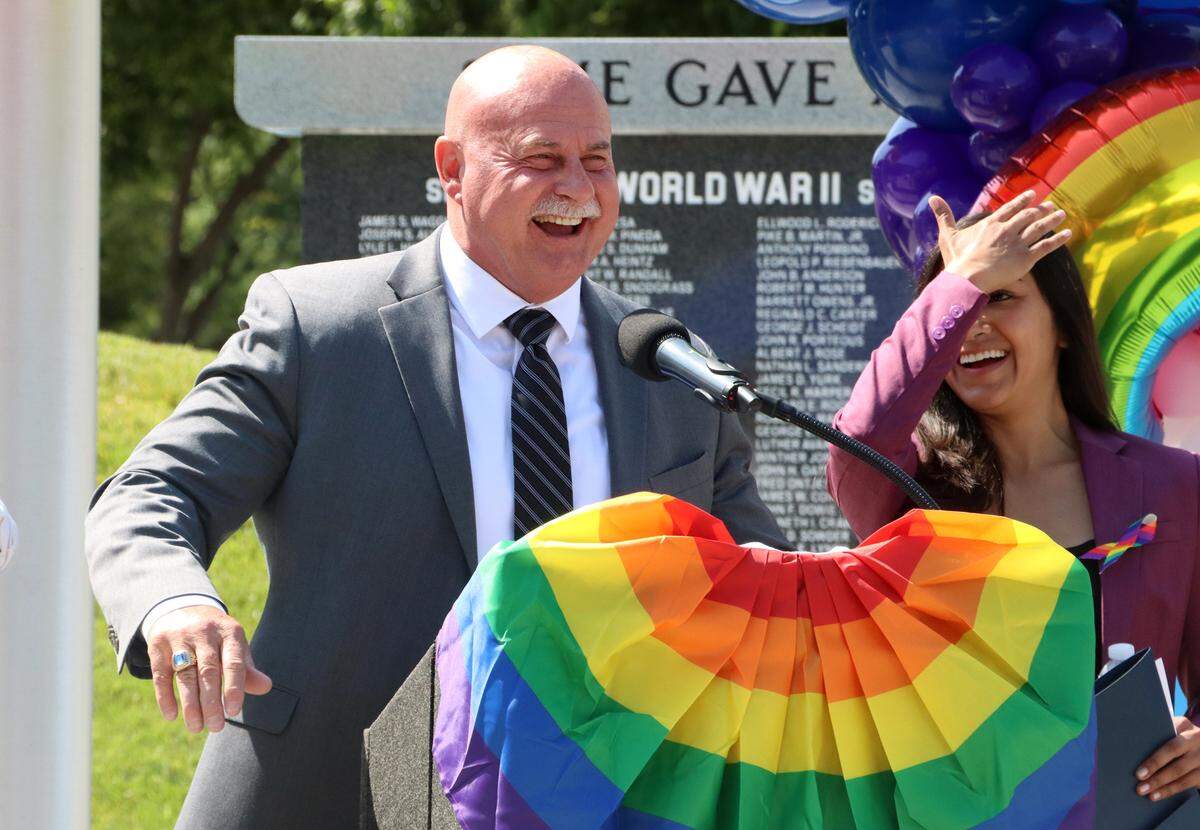 Fresno Mayor Jerry Dyer speaks at the pride flag-raising ceremony at City Hall on June 9.  To his left is Councilmember Annalisa Perea.