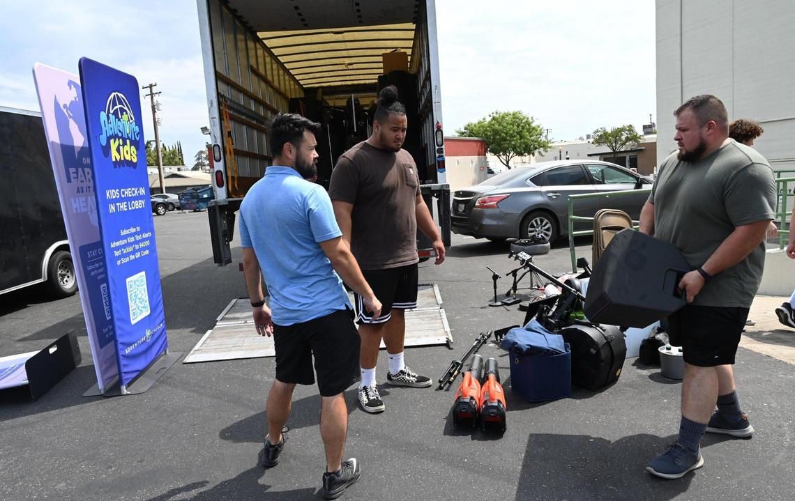 Workers for Adventure Church continue loading a moving van as the church moves out of the Tower Theatre Monday morning, Aug. 1, 2022 in Fresno.