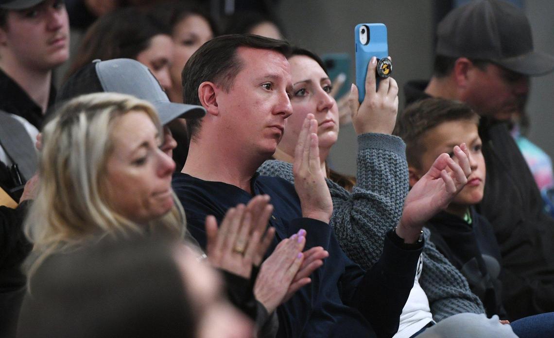 Members of the audience applaud a statement by the Clovis Unified School Board before voting to change COVID protocols in a special governing board meeting Wednesday, Feb. 23, 2022 in Clovis.