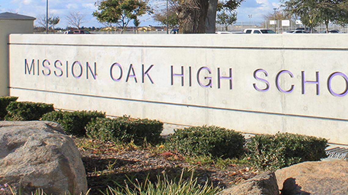 Tulare police arrested a 15-year-old Monday in connection with a school shooting threat at Mission Oak High.
