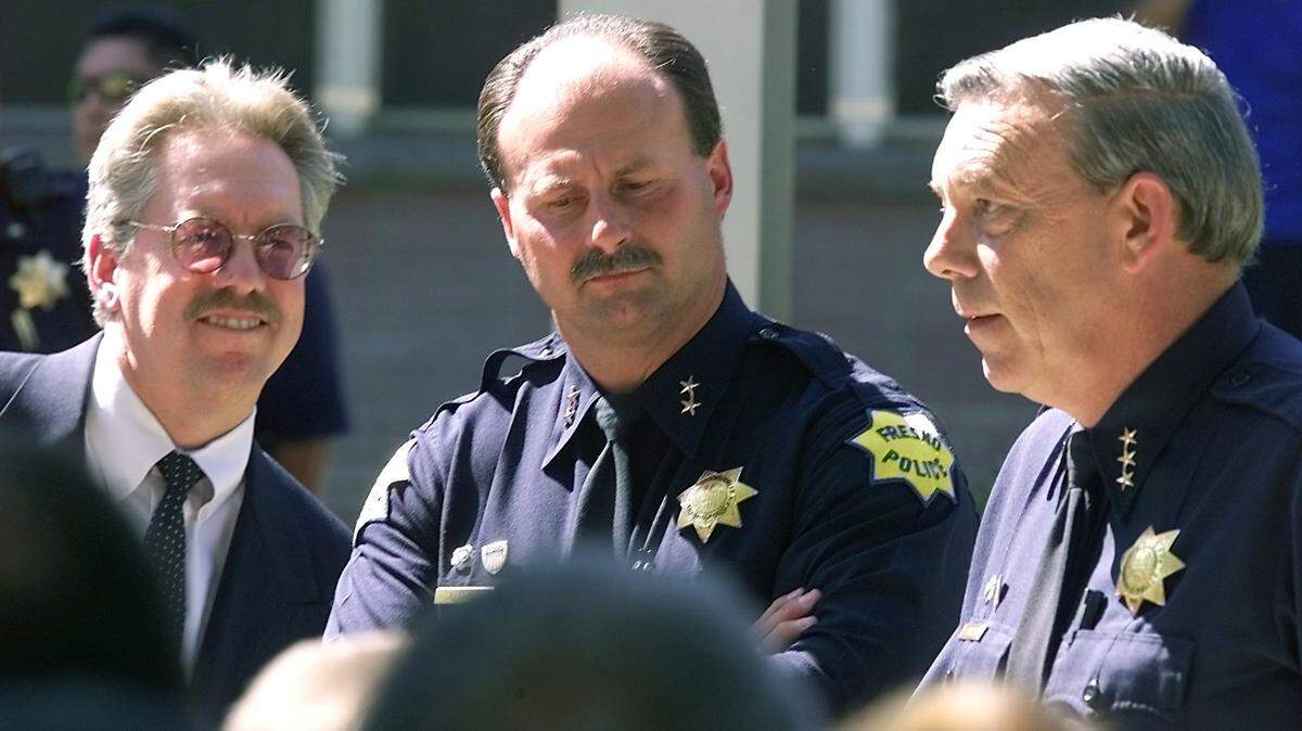 From left, Fresno City Manager Dan Hobbs, new Chief of Police Jerry Dyer and old Chief of Police Ed Winchester at the ceremony announcing the change in front of police headquarters on Wednesday afternoon July 18, 2001.