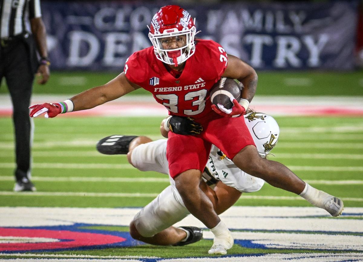 Fresno State running back Elijah Gilliam takes the ball upfield against Sacramento State at Valley Children’s Stadium in Fresno on Saturday, Sept. 7, 2024.