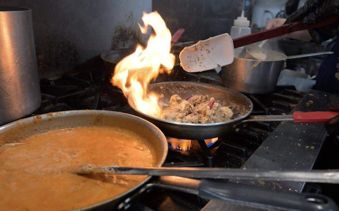 Chicken is cooked at Harpreet Singh and his wife Kiran Judge's new Chatore, a dine in and take out place serving fresh Indian food, desserts, drinks and more. Photographed Wednesday, Sept. 17, 2025 in Fresno.
