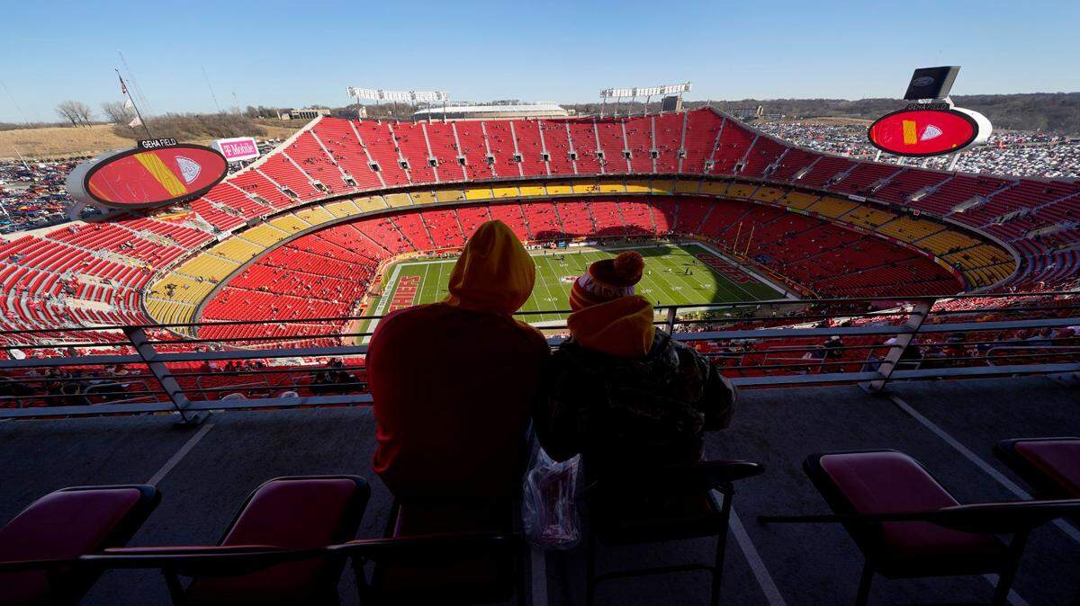 Fans prepare inside Arrowhead Stadium for the start of an NFL game between the Kansas City Chiefs and the Las Vegas Raiders Sunday, Dec. 12, 2021, in Kansas City, Mo.