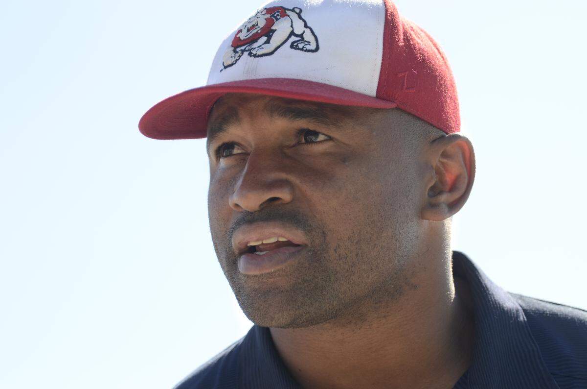 Lorenzo Neal was one of the stars of Fresno State’s 1992 Freedom Bowl win over USC. Looking back, he remembers how the Bulldogs silenced the USC marching band and its iconic fight song: “That song, when they get that going, the place starts rocking. When it got quiet and you knew that it was kind of over, we took their best punch and then we started running the ball and they had no answer, you’re like, ‘OK, they quit.’ “
