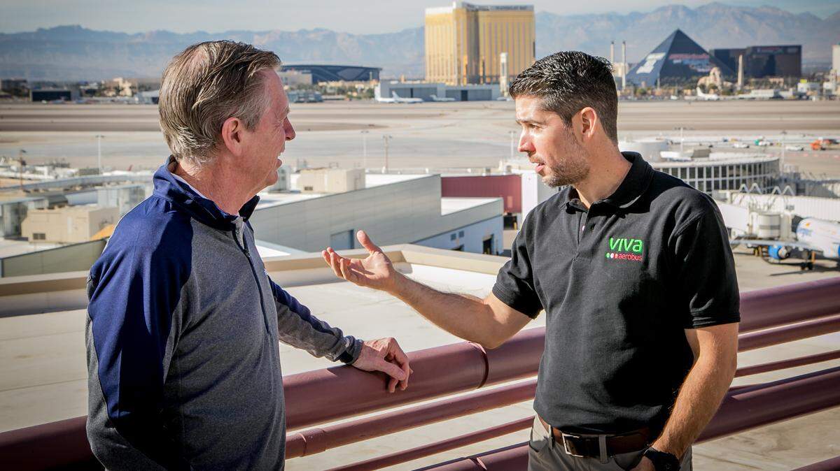 Allegiant Air chief executive Maurice Gallagher Jr., left, and Juan Carlos Zuazua, CEO of Mexico’s Viva Aerobus airline, meet at Henry Reid International Airport in Las Vegas. On Dec. 1, 2021, the two companies announced their intent to form a commercial alliance to expand nonstop flight routes between the U.S. and Mexico.