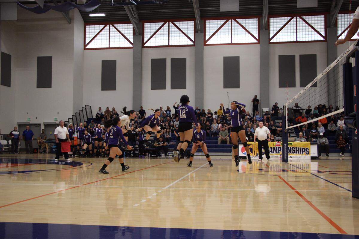Washington Union players celebrate the moment they won the school’s first Central Section girls volleyball championship.