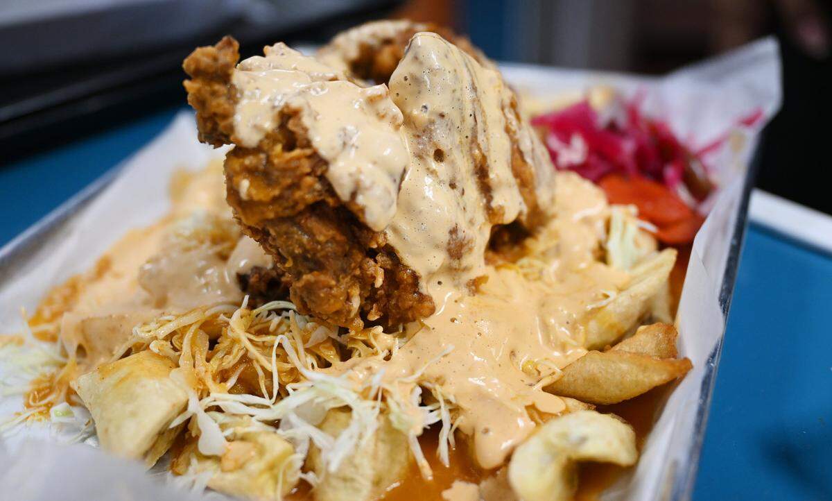 Pollo con Tajadas, chicken with fried plantains, served at Felix and Beatriz Amador's new Keidy's Restaurant on north Blackstone Ave, the first to offer Honduran food in Fresno. Photographed July 11,2025 in Fresno.